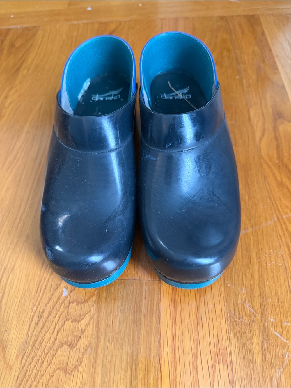 Dansko Black Clogs with Teal Accents